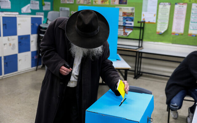 Israelis cast their votes at a voting station in Safed, during the municipal elections on February 27, 2024. (David Cohen/Flash90)