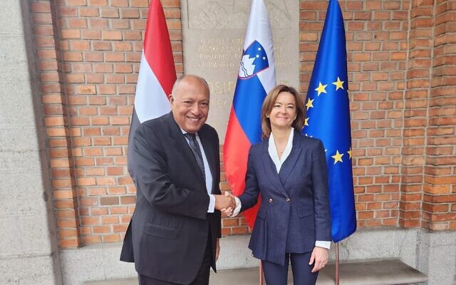 Egyptian Foreign Minister Sameh Shoukry (left) shakes hands with his Slovenian counterpart Tanja Fajon in Ljubljana, Slovenia, February 12, 2024. (Egyptian Foreign Ministry)