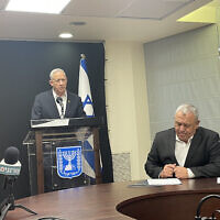 Ministers Benny Gantz (L) and Gadi Eisenkot present an outline for the draft of Arabs and ultra-Orthodox Jews into the Israeli army during a press conference in the Knesset, February 26, 2024. (Sam Sokol)