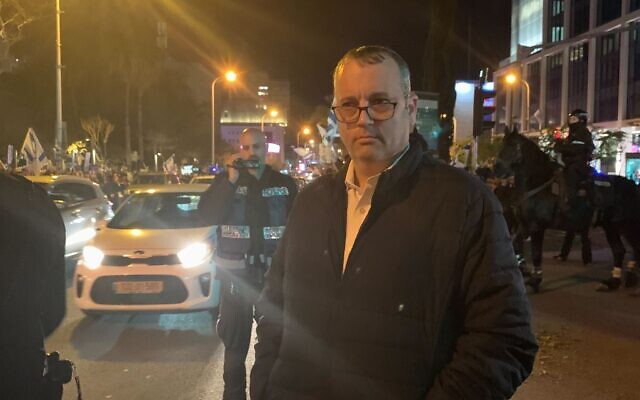 Labor MK Gilad Kariv makes an appearance at the anti-government protest in Tel Aviv on February 10, 2024. (Charlie Summers/Times of Israel)