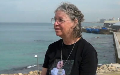 Freed hostage Aviva Siegel during an interview to Channel 12, aired February 16, 2024. On Siegel's shirt is a picture of her husband Keith, still in Hamas captivity. (Screen capture: Channel 12. Used in accordance with Clause 27a of the Copyright Law).