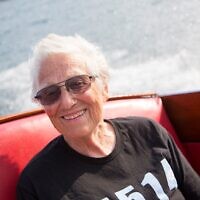 Ruth Fein, the first woman to chair Boston's Combined Jewish Philanthropies, enjoys a boat ride in Lake George, Massachuseets. (Michael Fein via JTA)