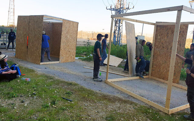Settler activists erect makeshift structures within the Erez border crossing complex leading from Israel to northern Gaza but within Israeli territory, February 29, 2024. (Courtesy: Nachala Settlement Movement)