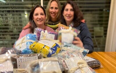 Left to right: Kate Gerstler, Shawna Goodman Sone and Saven Hilkowitz, the knitters behind 'Scarves of Love' for the hostages held in Gaza. (Courtesy)