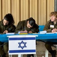 This handout photo published on February 20, 2024, shows IDF soldiers operating a military polling station. (Israel Defense Forces)