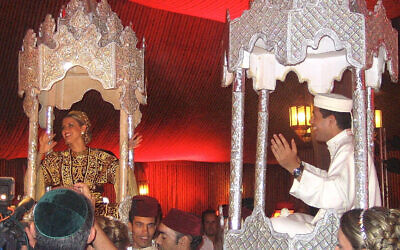 Bride Esther and groom Steeve are carried on ornate thrones at their henna party in the week leading up to their wedding in 2007 in Casablanca, Morocco. (Courtesy of Indiana University Press)