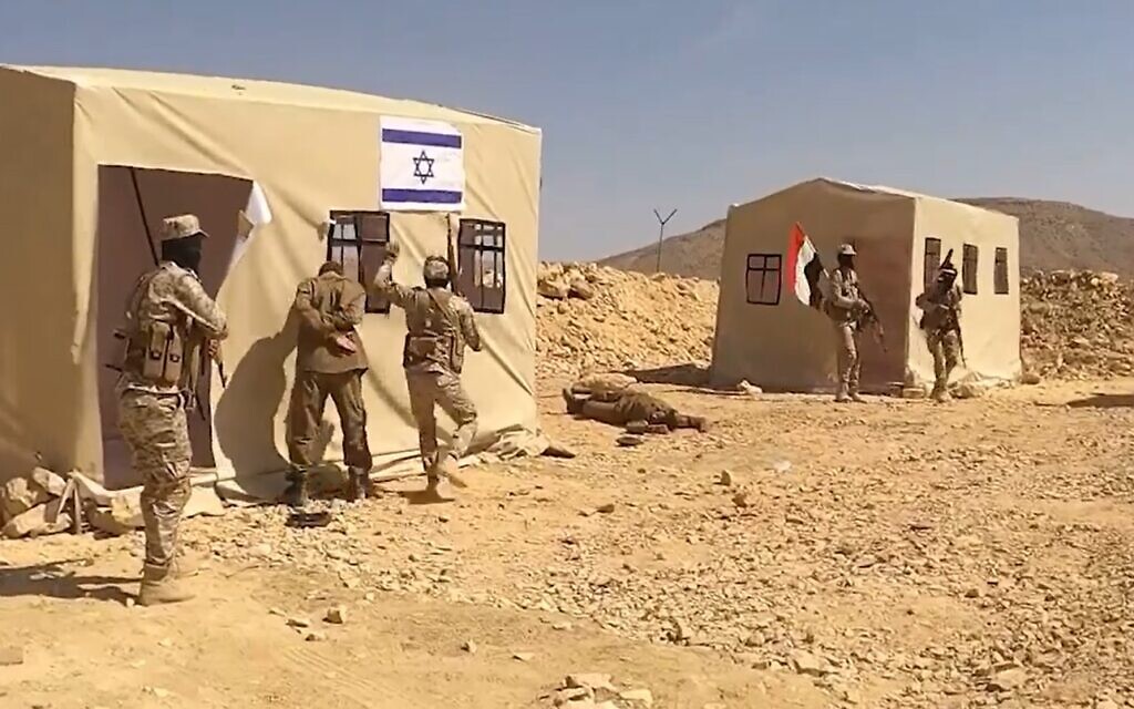 A clip from Houthi propaganda footage showing a raid on an "Israeli base" and a soldier being taken captive, which aired February 4, 2024. (Screen capture: X)