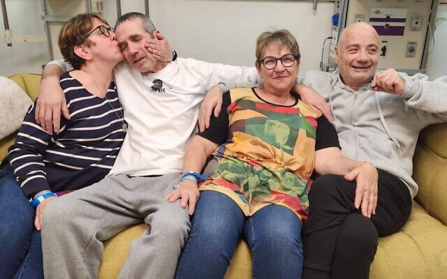 From L-R:  Gabriela Leimberg kisses her brother Fernando Marman, Clara Marman next to her partner Louis Har, at the Sheba Medical Center, February 12, 2024 (Courtesy)