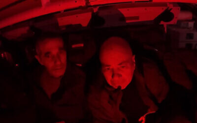A screenshot from footage from February 12, 2024, from an APC showing Shayetet 13 commandos asking Fernando Marman (left) and Louis Har (right) about their wellbeing, shortly after they were rescued after being held by Hamas terrorists in the Gaza Strip since October 7. (Israel Defense Forces)