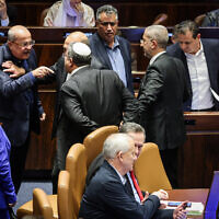 Hadash-Ta’al chairman Ahmad Tibi argues with National Security Minister Itamar Ben Gvir during a vote on the amended 2024 budget, March 13, 2024. (Noam Moskowitz, Office of the Knesset Spokesperson)