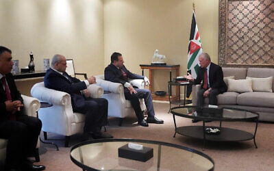 Jordan's King Abdullah II (R) speaks with Hadash-Ta'al head Ayman Odeh and MKs Ahmad Tibi and Youssef Atauna in Amman, Jordan, March 4, 2024. (Royal Hashemite Court)