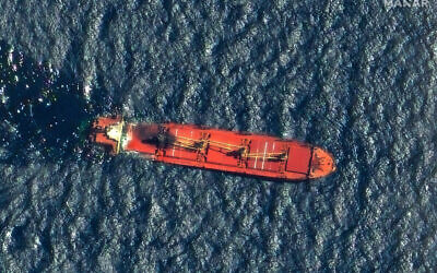Belize-flagged cargo ship Rubymar, damaged in a February 19 missile strike claimed by the Iran-backed Houthi rebels, floats in the Red Sea. (Satellite image ©2024 Maxar Technologies / AFP)