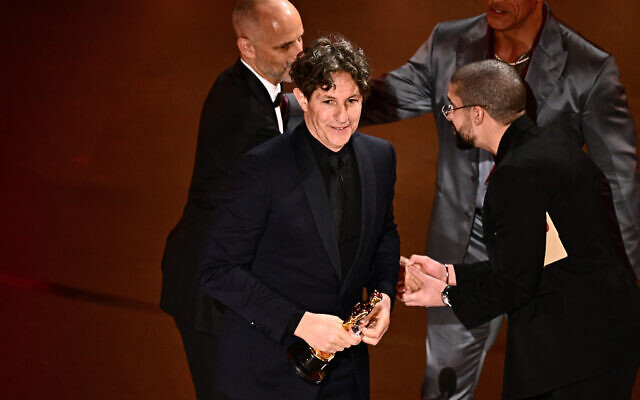 Director Jonathan Glazer accepts the award for Best International Feature Film for "The Zone of Interest," onstage during the 96th Annual Academy Awards at the Dolby Theatre in Hollywood, California on March 10, 2024. (Patrick T. Fallon / AFP)