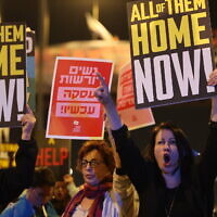 Relatives and supporters of Israeli hostages held in Gaza since the October 7 attacks by Hamas hold placards during a demonstration in Tel Aviv calling for their release, on March 26, 2024. (Jack Guez/AFP)