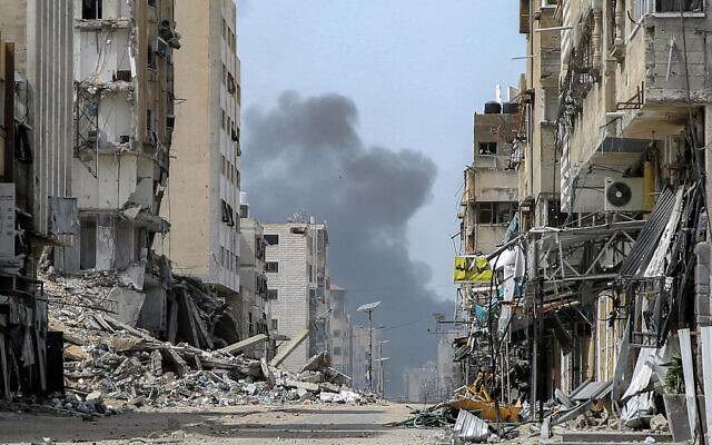 Smoke rises during an Israeli strike in the vicinity of the al-Shifa hospital in Gaza City on March 28, 2024. (AFP)