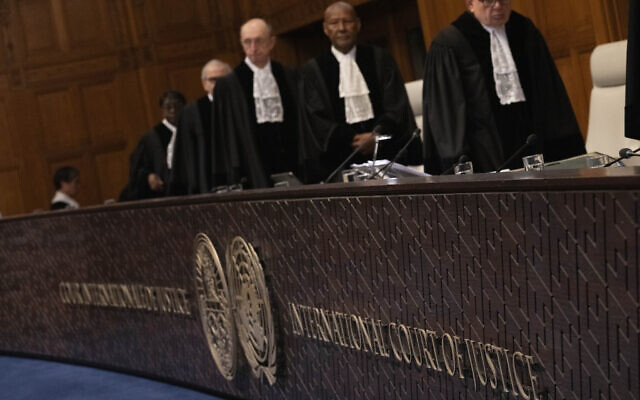 Judges enter the United Nations' highest court during hearings in The Hague, Netherlands on February 21, 2024. (AP Photo/Peter Dejong)