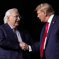 Republican presidential candidate former president Donald Trump, right, greets David Friedman, who served as ambassador to Israel in the Trump administration, at the National Religious Broadcasters convention at the Gaylord Opryland Resort and Convention Center on February 22, 2024, in Nashville, Tennessee. (AP Photo/George Walker IV)