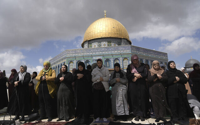 Muslim worshippers pray beneath the Dome of the Rock at the Al-Aqsa Compound atop the Temple Mount on the second Friday prayers of the Muslim holy month of Ramadan, in Jerusalem's Old City, Friday, March 22, 2024. (AP Photo/Mahmoud Illean)