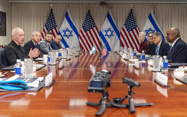 Defense Minister Yoav Gallant, at far left, speaks while meeting with US Defense Secretary Lloyd Austin, across table at far right, at the Pentagon, Tuesday, March 26, 2024, in Washington. (AP Photo/Jacquelyn Martin)