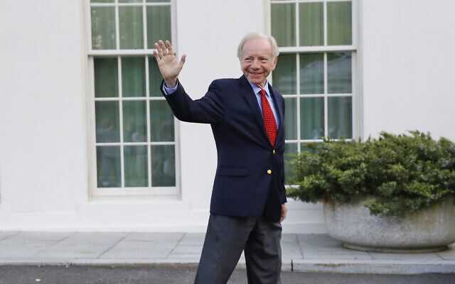 Former Connecticut Sen. Joe Lieberman waves to members of the media as he leaves the West Wing of the White House in Washington, May 17, 2017. (AP Photo/Pablo Martinez Monsivais, File)