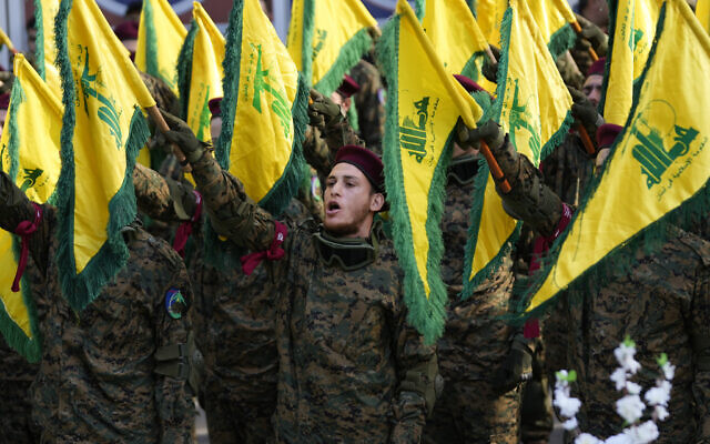 Hezbollah fighters attend the funeral of their commander Wissam al-Tawil, in the village of Khirbet Selm, south Lebanon, January 9, 2024. (AP Photo/Hussein Malla, File)
