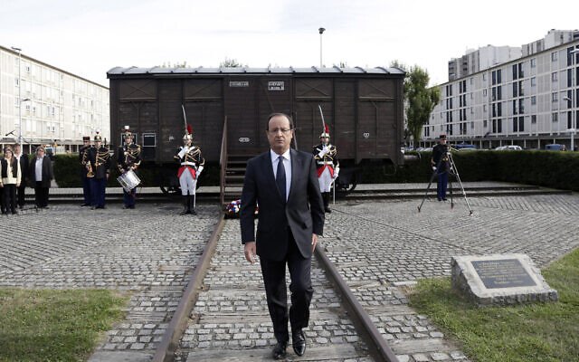 Then-French president Francois Hollande walks back from a train car commemorating the Drancy concentration camp, during the inauguration of a new Holocaust memorial in Drancy, a Paris suburb, France, September 21, 2012. (AP Photo/Philippe Wojazer, Pool)