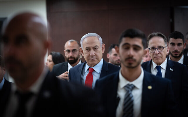 Prime Minister Benjamin Netanyahu walks outside his office at the Knesset in Jerusalem on March 13, 2024. (Yonatan Sindel/Flash90)