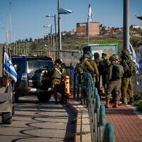Security forces at the scene where a Palestinian man was shot by troops near Elazar, in Gush Etzion, in the West Bank, on March 21, 2024 (Gershon Elinson/Flash90)