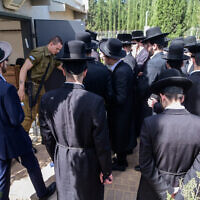Ultra-Orthodox men arrive at the IDF Recruitment Center at Tel Hashomer, in central Israel, March 28, 2024. (Avshalom Sassoni/Flash90)