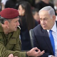 IDF Chief of Staff Lt. Gen. Herzi Halevi (left) and Prime Minister Benjamin Netanyahu attend a cadets graduation ceremony at the IDF's officers school in southern Israel, known as Bahad 1, March 7, 2024. (Amos Ben Gershom/GPO)