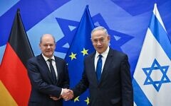 German Chancellor Olaf Scholz, left, shakes hands with Prime Minister Benjamin Netanyahu, during a press conference in Jerusalem, March 17, 2024. (GPO)