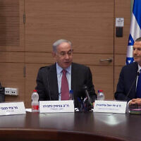 Prime Minister Benjamin Netanyahu, center, attends a meeting of the Knesset Foreign Affairs and Defense Committee on March 19, 2024. At left is National Security Adviser Tzachi Hanegbi and at right is committee chairman Yuli Edelstein. (Screenshot/GPO)