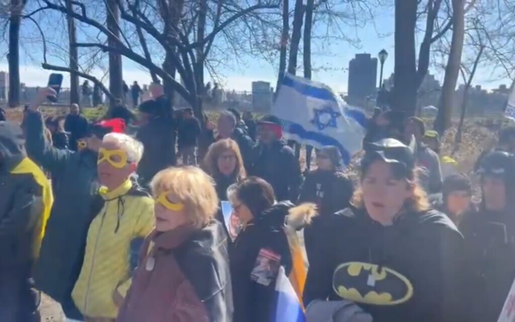 At NY hostage rally, demonstrators wear batman masks to honor 4-year-old captive