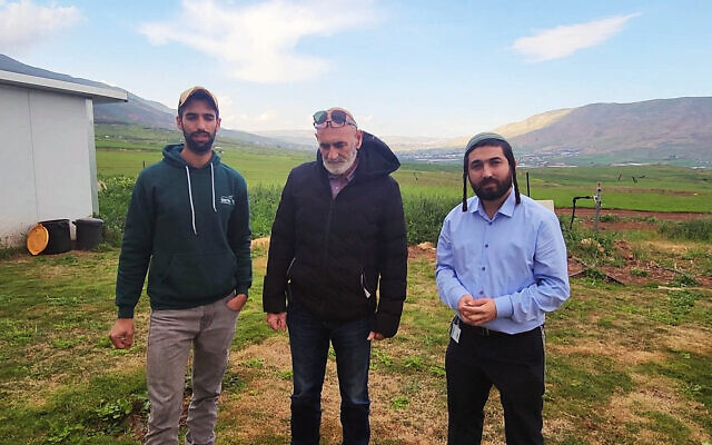 Moshe Sharvit (left) who runs the Emek Tirzah Farm illegal outpost in the West Bank and was sanctioned by the US in March for violent activity against local Palestinians, is visited by Religious Zionism MK Tzvi Succot (right) and chairman of the Jordan Valley Regional Council David Elhayani (center) at the oustpost, February 15, 2024. (Courtesy Office of MK Tzvi Succot)