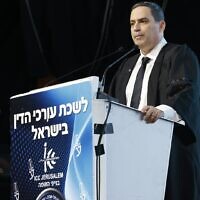 Head of the Israel Bar Association (IBA) Amit Becher addresses an IBA ceremony, March 20, 2024. (Courtesy Israel Bar Association/Yossi Zamir)