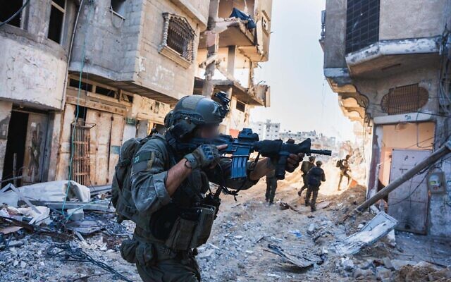 Troops of the Commando Brigade operate in the Khan Younis neighborhood of al-Amal, in a handout image published March 28, 2024. (Israel Defense Forces)