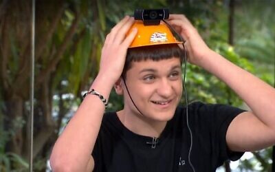 High school student Itai Levy demonstrates his prototype of a facial recognition device which could be added to IDF soldiers' equipment. (Image capture from a Channel 13 broadcast/used in accordance with clause 27a of the Copyright Law)