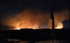 A screenshot of video from social media shows fire after a reported airstrike on a military base used by a coalition of pro-Iran militias in Iraq, early April 20, 2024. (X video screenshot; used in accordance with Clause 27a of the Copyright Law)