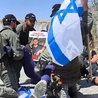 Activists blocking the Nitzana goods crossing are forcibly removed by police during protests against the transfer of humanitarian aid to Gaza by Israel, April 11, 2024. (Courtesy Tzav 9)