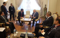 This handout picture provided by the Palestinian Authority's press office (PPO) shows Palestinian Authority President Mahmoud Abbas (C-R) meeting with Spain's Prime Minister Pedro Sanchez (C-L) on the sidelines of the International Peace Summit in the New Administrative Capital (NAC), about 45 kilometers east of Cairo, on October 21, 2023. (Thaer Ghanaim/PPO/AFP)