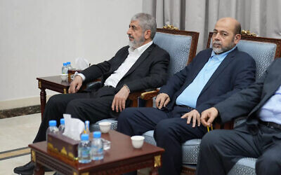 File: Senior Hamas leader Khaled Mashaal (L) and senior Hamas member Mousa Abu Marzouk attending a meeting between Iran's Foreign Minister and Hamas' political bureau chief in Doha, October 31, 2023. (Iranian Foreign Ministry/AFP)