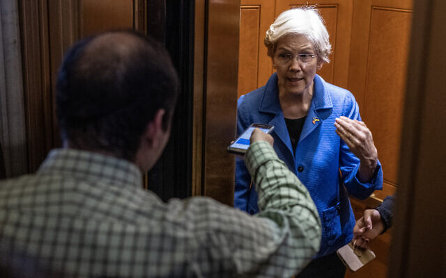 File - US Senator Elizabeth Warren (D-MA) speaks to reporters outside the Senate chambers before a procedural vote at the US Capitol in Washington, DC, on February 12, 2024. (Andrew Caballero-Reynolds/AFP)