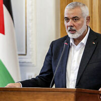 File: Ismail Haniyeh, the Doha-based political bureau chief of Hamas, speaks to the press after a meeting with the Iranian foreign minister in Tehran on March 26, 2024. (AFP)