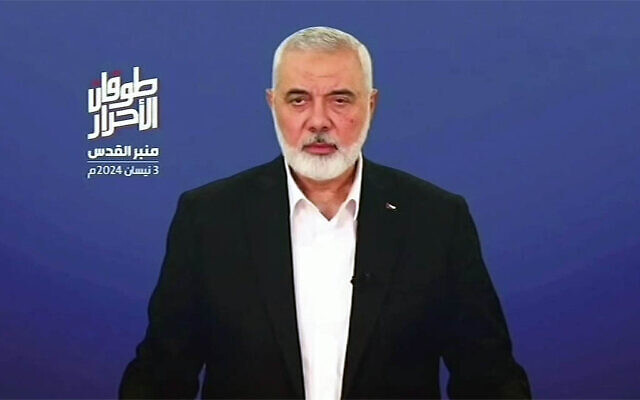 Ismail Haniyeh, the Doha-based political bureau chief of the Palestinian terror group Hamas, speaks on a televised speech on the occasion of Quds [Jerusalem] Day on April 3, 2024. (Hamas Media Office/AFP)