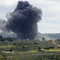 Smoke billows after an alleged Israeli strike on the southern Lebanese border village of Tayr Harfa on April 6, 2024. (Kawnat Haju/AFP)