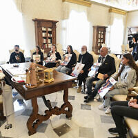Pope Francis during a meeting with relatives of Israeli hostages the Bibas family (Shiri, Yarden, Ariel, Kfir), Omri Miran, Agam Berger, Guy Gilboa Dalal and Tamir Nimrodi, held in the Gaza Strip by Palestinian terrorists, seen at the Vatican City, April 8, 2024. (VATICAN MEDIA / AFP)