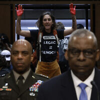 Protesters interrupted US Defense Secretary Lloyd Austin as he testified before the Senate Armed Services Committee in the Hart Senate Office Building on Capitol Hill on April 9, 2024 in Washington, DC. (Chip Somodevilla/Getty Images North America/Getty Images via AFP)