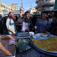 Palestinians sell sweets in Rafah in the southern Gaza Strip on April 9, 2024. (Mohammed Abed/AFP)