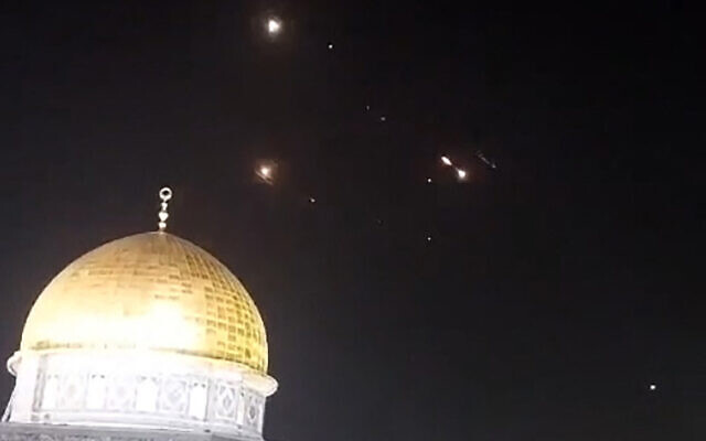 An image grab from a video taken early on April 14, 2024, shows the Dome of the Rock atop the Temple Mount in Jerusalem's Old City, with the lights of missile interceptions visible in the night sky, early on April 14, 2024, after Iran fired ballistic missiles at Israel (AFP)