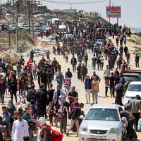 Displaced Palestinians taking the coastal Rashid road as they attempt to return to Gaza City pass through Nuseirat in the central Gaza Strip, on April 14, 2024. (AFP)